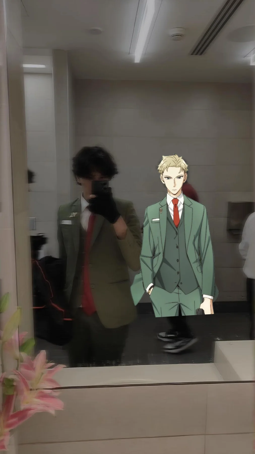 Mirror photograph of the green-suit cosplay with a stylized character overlay