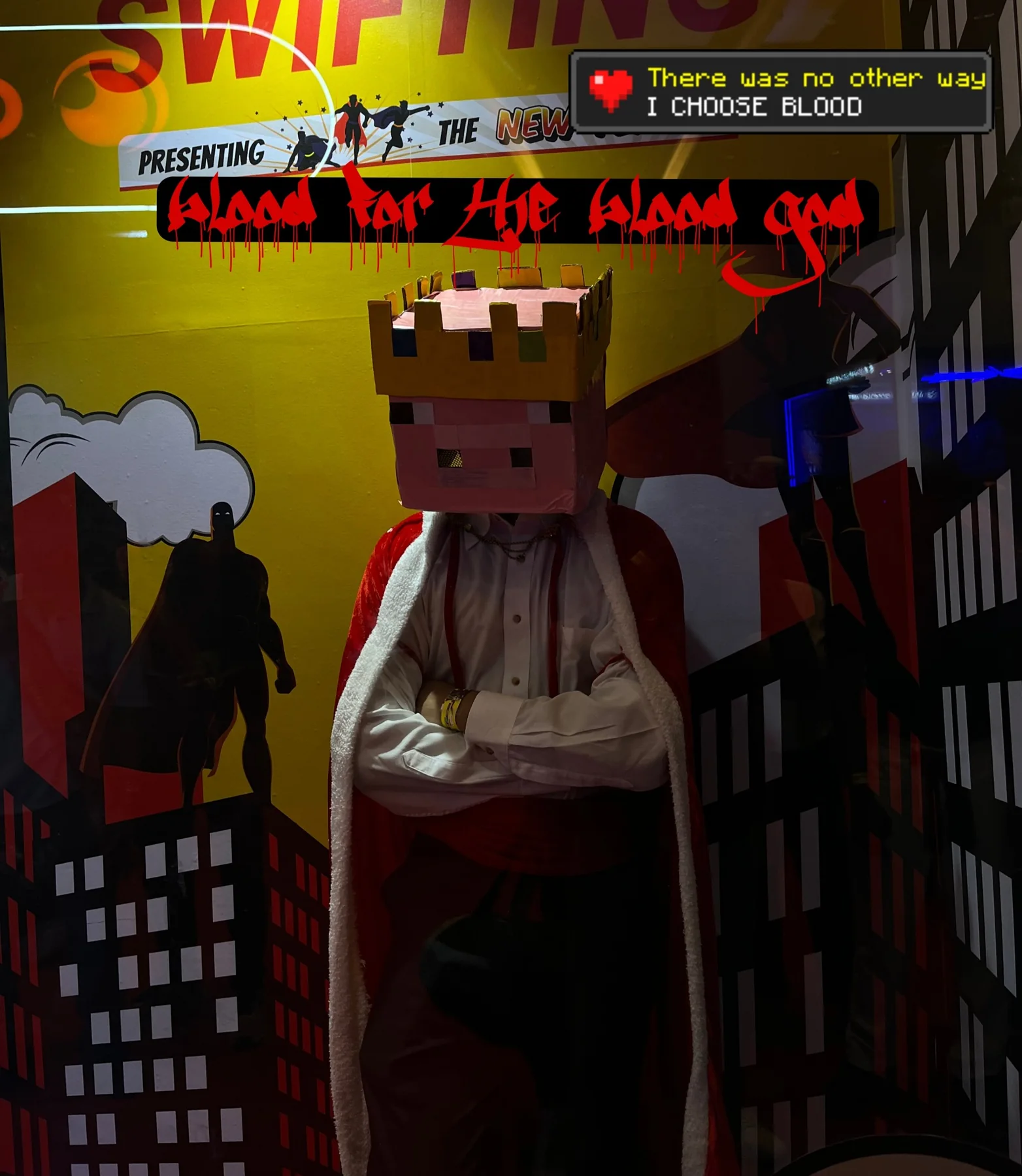 Cosplay portrait wearing a handmade pig-king helmet and red cape against a dramatic convention backdrop