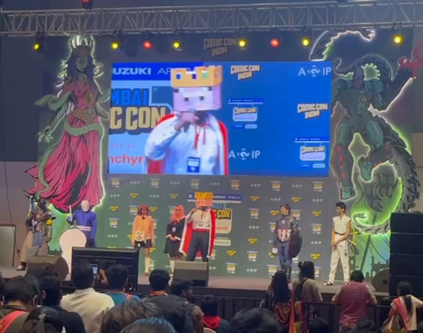 Pig-king cosplay appearing on a convention stage