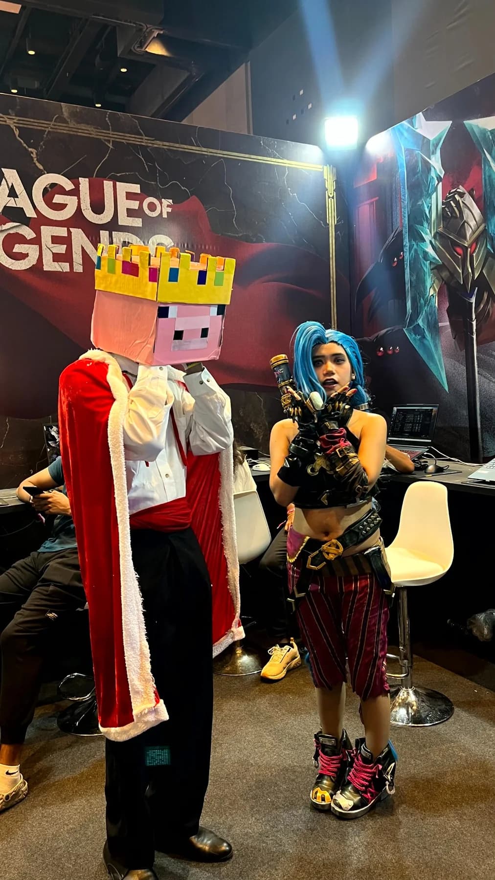 Convention photo of the pig-king cosplay with a blue-haired cosplayer