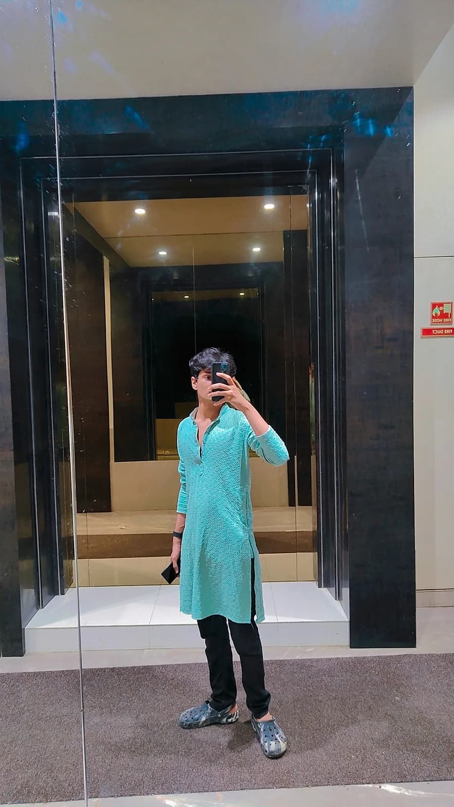 Mirror portrait in an aqua kurta